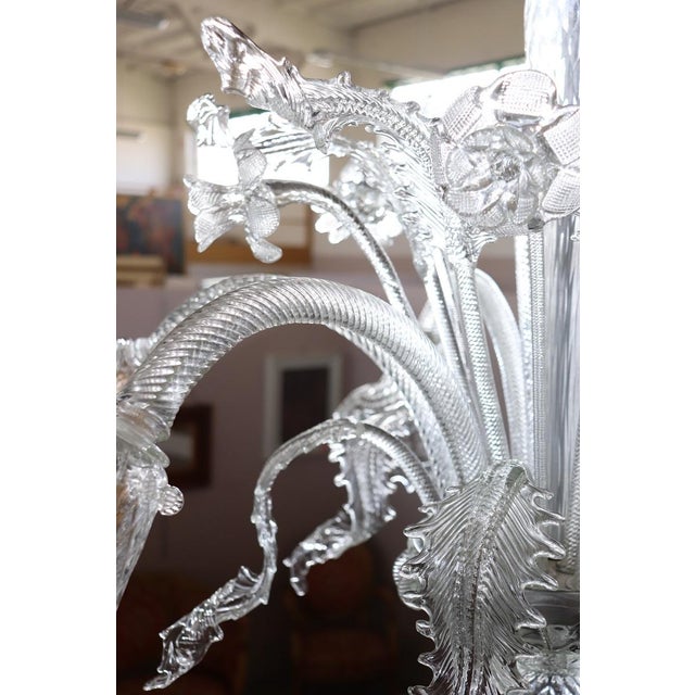 Introducing a stunning Italian chandelier crafted from exquisite Murano glass, dating back to the 1980s. This chandelier...