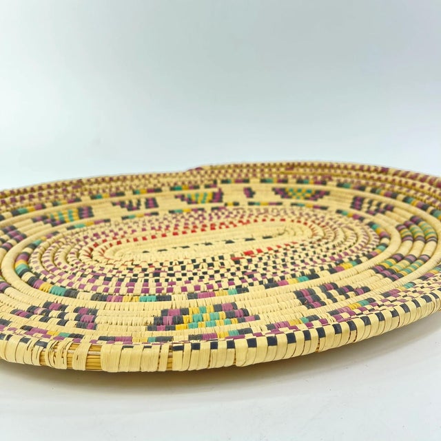 This vintage handmade basket, crafted by the Hausa people of Northern Nigeria, is an exquisite example of traditional...