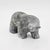 A signed carved stone bear sculpture by Ben Saclamana, an Inupiaq / Inuit artist associated with King Island, Alaska....