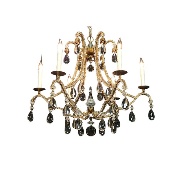 Magnificent large chandelier made by Dennis & Leen. This incredible piece features a gilt iron frame with crystal beading...