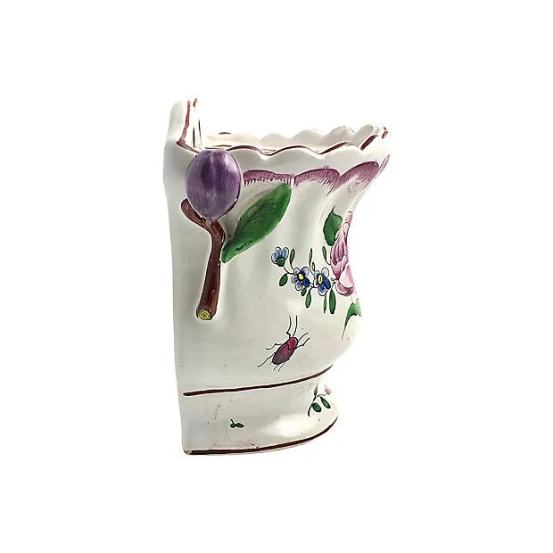 Antique wall pocket painted with purple flowers and green leaves. Applied tulip handles on each side. Two holes on back...