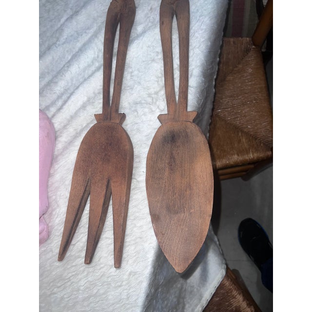 Beautiful carved African spoon and fork decor. Beautiful pieces to add to your collection. Solid wood. Great pieces....