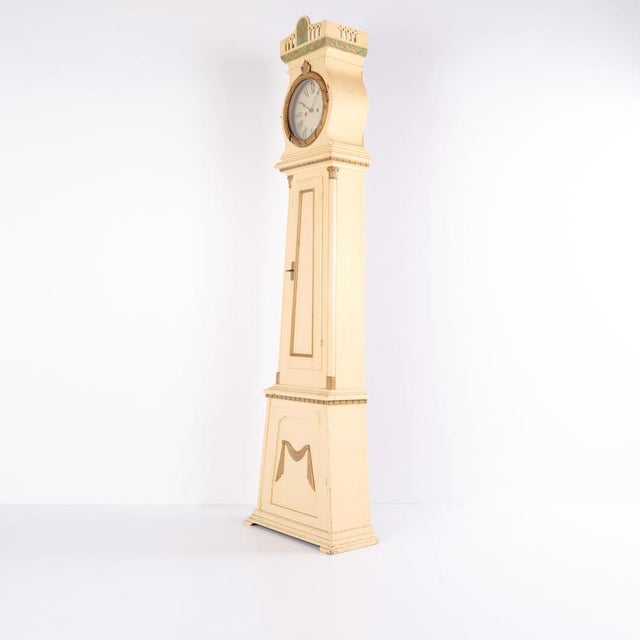 Bornholm clock of the “frøken” type from around the 1790s. White-painted case with decorative detailing and the...