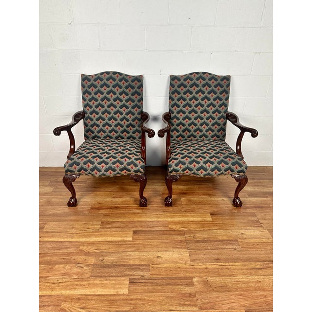 These Southwood Ball & Claw Chippendale style armchairs with nailheads are covered in a multicolor upholstery. They have a...