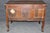 This exceptional period French Louis XV walnut commode, crafted during the 1780s, represents the graceful refinement and...