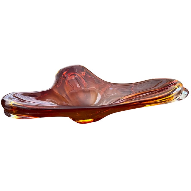 A striking mid-century Venetian-style art glass dish, executed in a richly saturated amber-to-cognac gradient with...