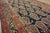 This Antique Persian Malayer Hallway Runner Rug, dating back to the 1900s, is a stunning example of village weaving from...