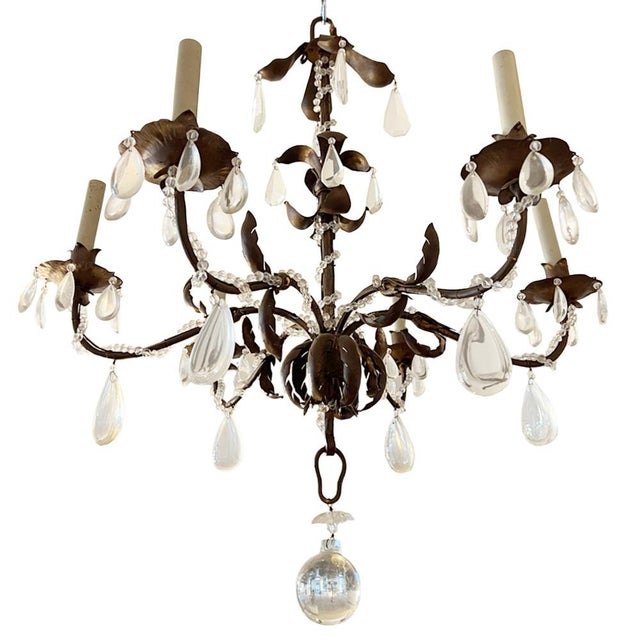 This is a really stunning large chandelier. The elegant gilded tole wear frame is decorated with large drops of varying...