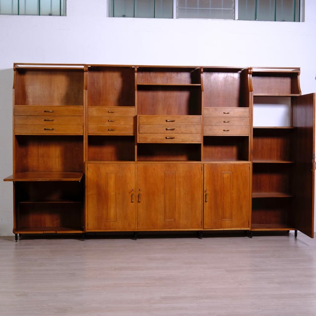Nice bookcase, Italian design and production from around the 1960s. The structure is very solid, made up of three blocks...