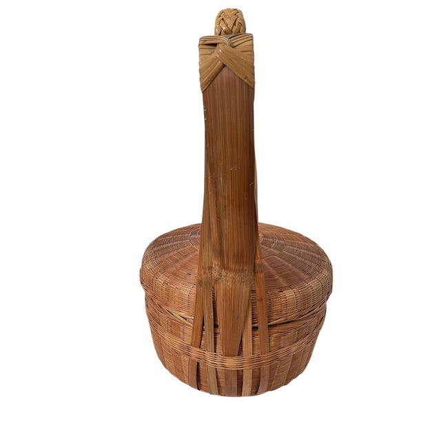 The Vintage Wicker Chinese Wedding Basket with Handle is a unique and authentic piece originating from China. Standing at...