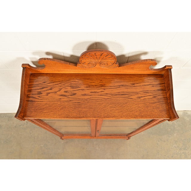 Early 20th Century Antique Victorian Carved Oak Two-Door Bookcase Cabinet | Circa 1920s For Sale - Image 5 of 13