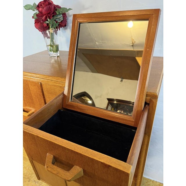 A rare and highly desirable mid-century oak compactum gentleman’s wardrobe by g plan, bearing the original e. Gomme gold...