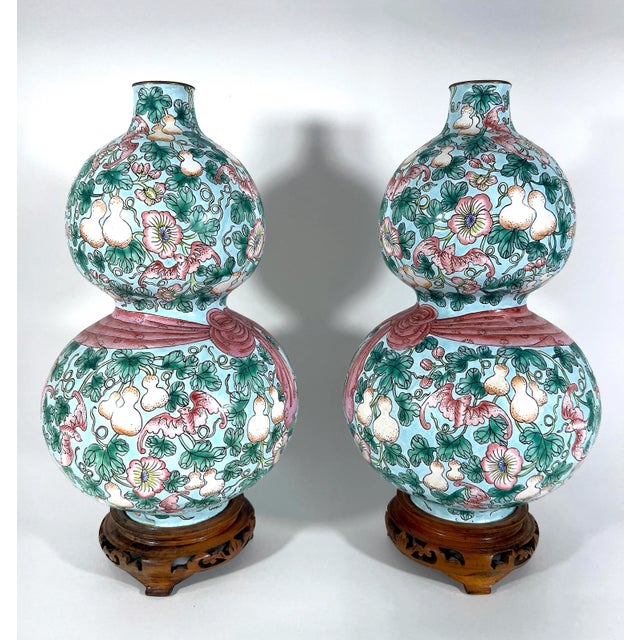 A very rare pair of delightful pastel pink, green, and turquoise/pale blue double gourd opposing enamel vases. A pretty...