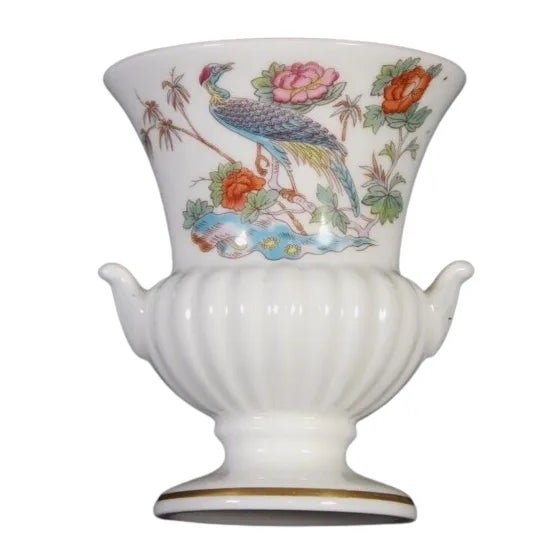 I see no damage as in chips, cracks, crazing or worn spots to the gold rim or painted areas. There is on the inside a dark...