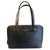 This authentic Gucci shoulder bag dated 1990s is crafted from premium black textured leather, offering a sleek and...