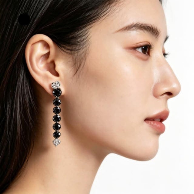 Elegant 18K white gold chandelier earrings featuring a floral design with black and white diamonds 3.2 carats black, 1...