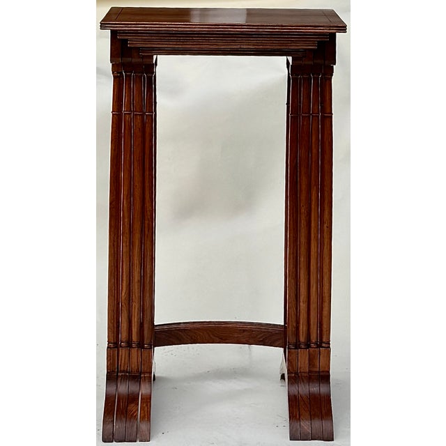 Elegant Anglo-Indian Regency nesting tables, circa 1815, crafted in richly grained padauk hardwood with ebony-banded,...