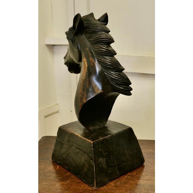Large Carved Wooden Horse Head This Superb character is carved from a single piece of wood and is set on a wooden stand,...