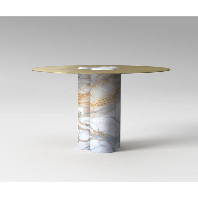 Jumbo Calacatta Table by Etamorph Dimensions: ⌀ 120-140 x H 74 cm. Materials: Calacatta + Brass. Base carved from a block...