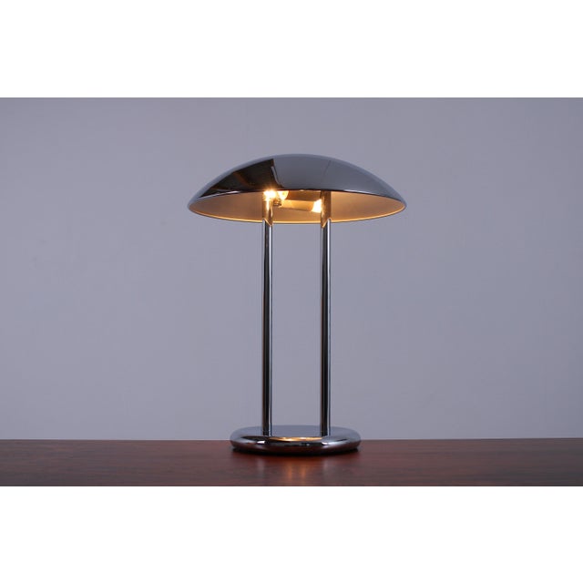 This elegant and quite large and heavy 1980ies lamps displays the exemplary talent of the postmodern European procuct- and...