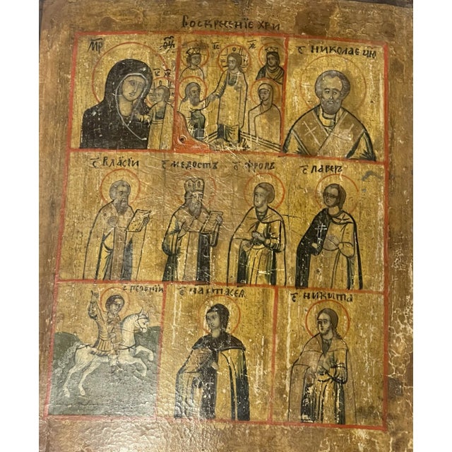 A remarkable 19th-century Russian School icon, meticulously painted in three registers, reflecting the depth and richness...