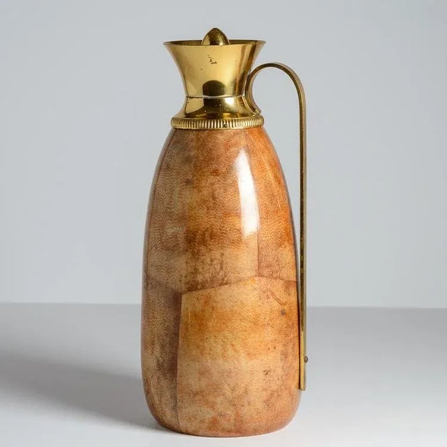 Just in, This Italian Lacquered Goatskin & Brass Thermos by AldoTura, 1960s. Beautiful honey color to the lacquered...