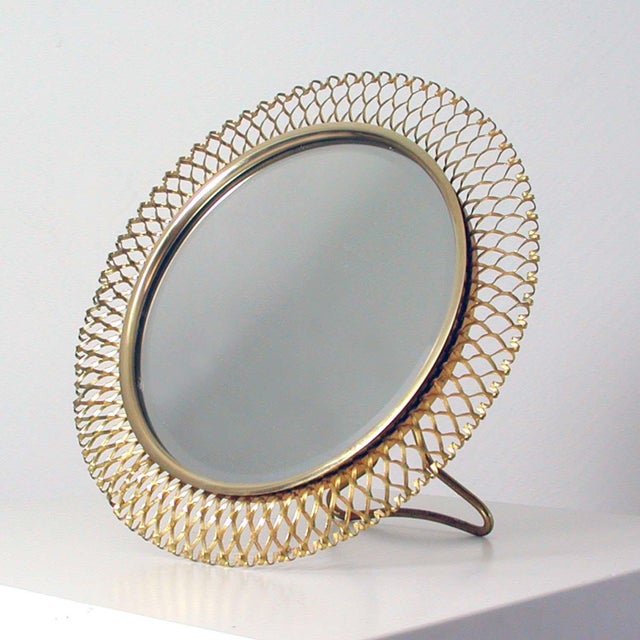 This beautiful round midcentury table mirror was designed and manufactured in Germany in the 1950s by Vereinigte...