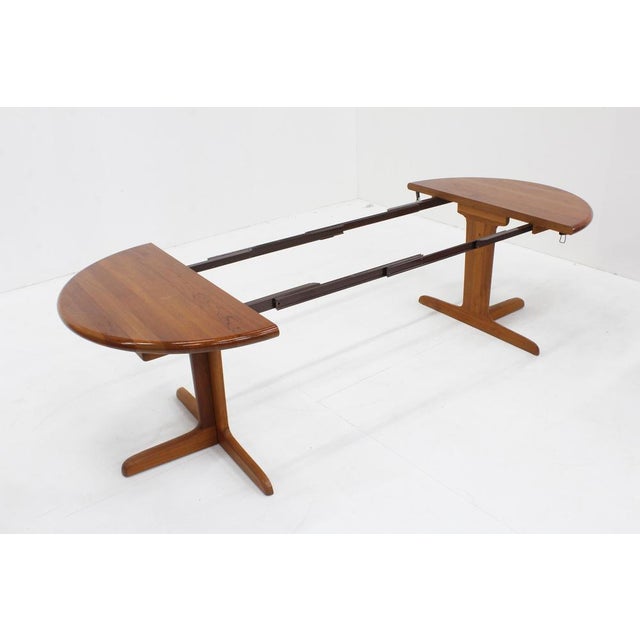 Vintage Danish large round extendable dining table from the 1960s made of solid teak wood by the danish furniture maker...