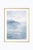 Minimalist coastal artwork featuring a soft, misty horizon with distant shoreline fading into layered blue tones. Gentle...