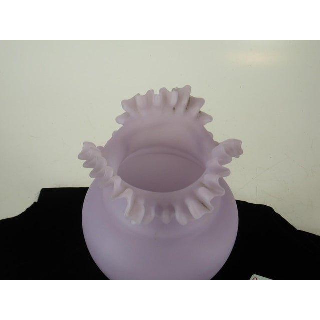 This large 13" Victorian Purple Mouth Blown Frosted Glass Vase features a unique ruffled top and an asymmetrical shape,...