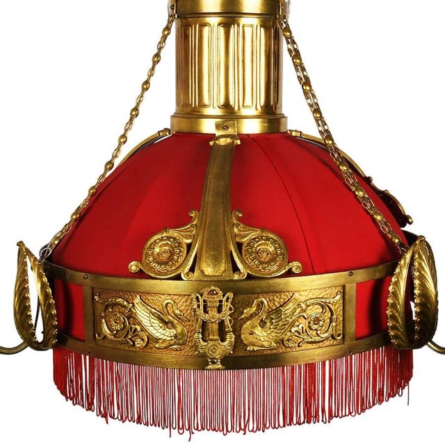This Antique Neoclassical Gilt Bronze Sanctuary Chandelier is an exceptionally decorative lighting fixture that embodies...