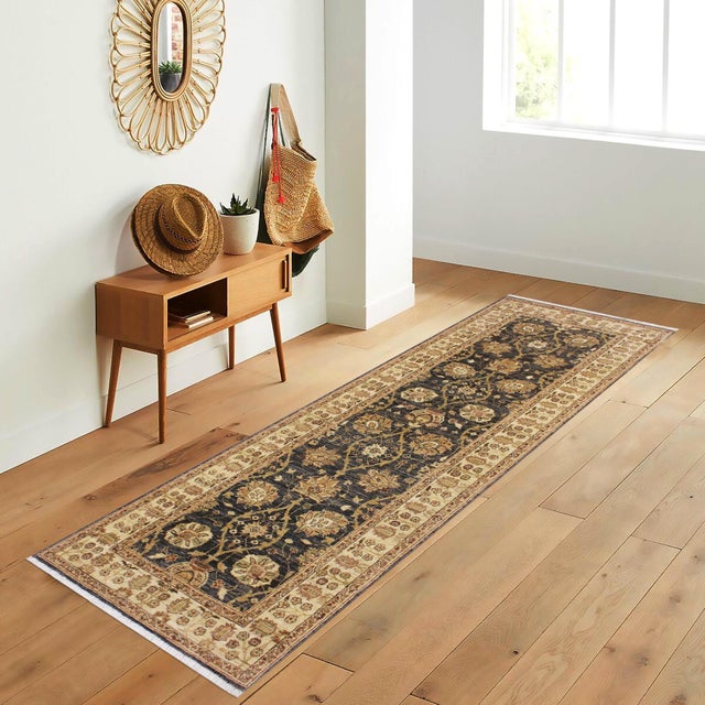 Enhance the ambiance of your home with this magnificent Persian-influenced Turkish hand-knotted rug made by skilled...