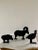 A charming set of three farmhouse country cast iron door stops or garden art in the form of a ram, pig, and quail. USA,...