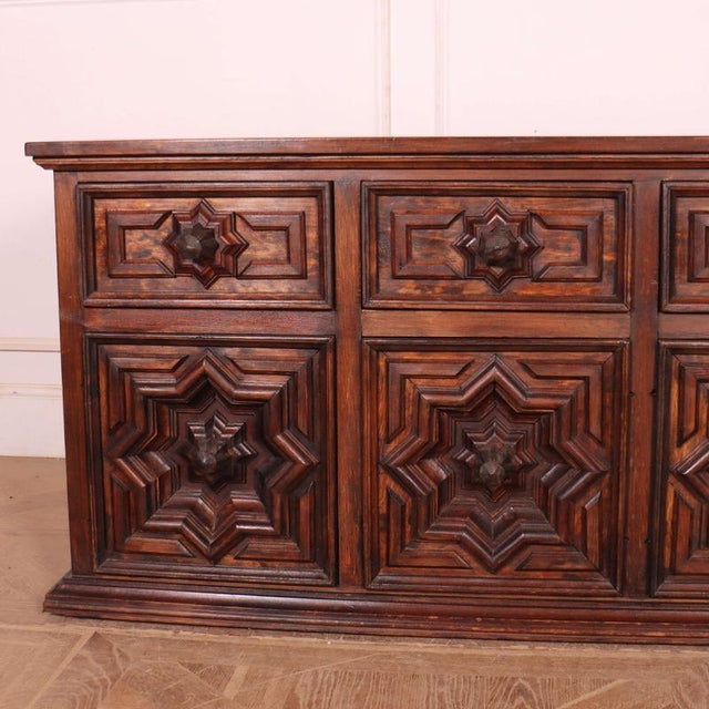 A striking 1970's Spanish brutalist sideboard with four drawers/doors with bold geometric star decoration and metal knobs....