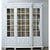 A large 19th century French pine bibliotheque with its original white paint. The cornice juts out sharply from atop four...