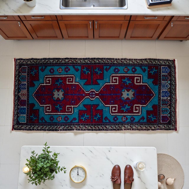 Authentic hand-knotted mini rug featuring turquoise and rust red tones with bold geometric Anatolian motifs — perfect for...