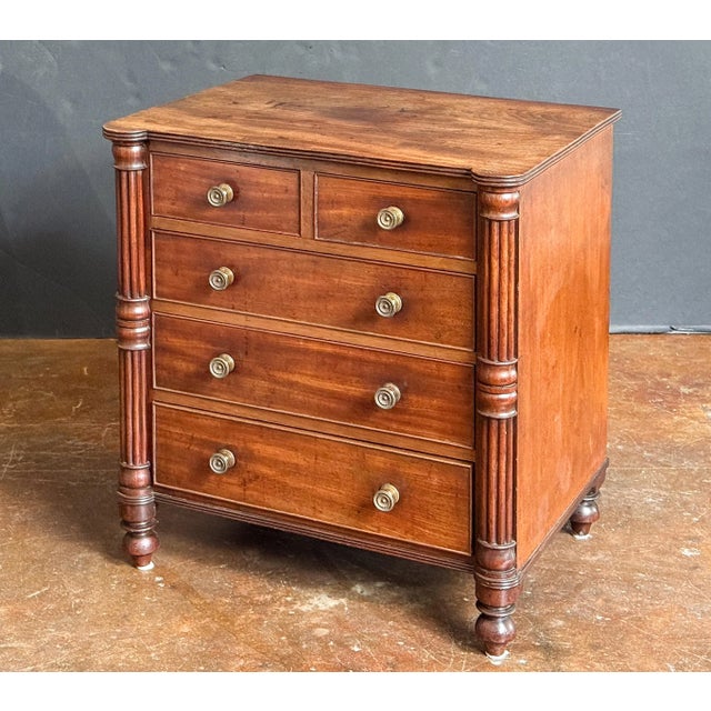 A fine small English chest of drawers or commode dresser of mahogany from the Regency Period, in the manner of Gillows,...