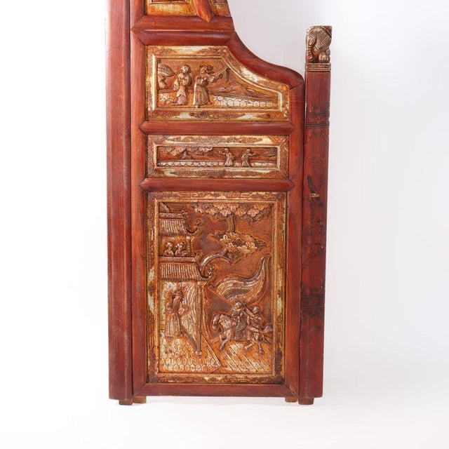 A substantial Chinese carved rosewood entry panel, dating from the 20th century, presents a remarkable example of...