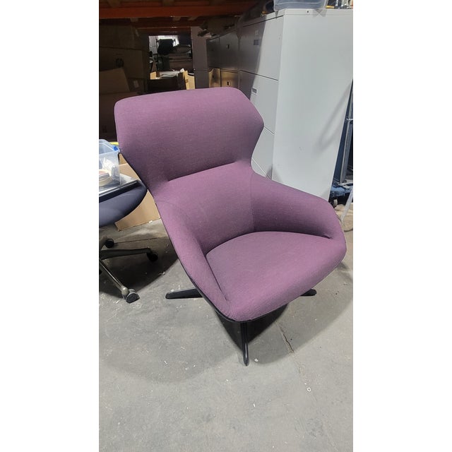 The Davis Ginkgo Lounge Chair in Purple is a striking modern piece that blends comfort with sculptural design. Its...