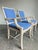 Pair of Lane Venture rattan armchairs from the Excursions collection, featuring a refined lattice back design and light...