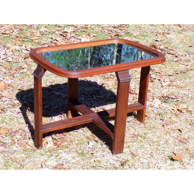 Vintage Art Deco End Table features a solid Walnut frame with an oval mirrored glass top with ridged edges and X base with...