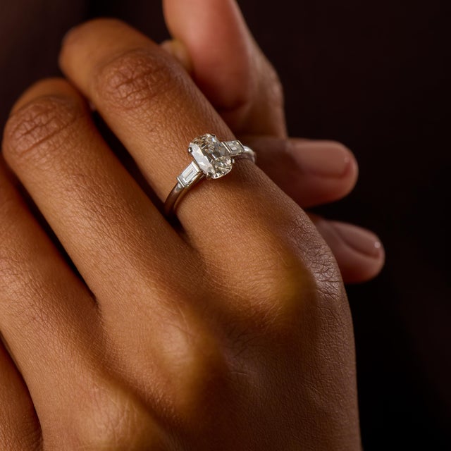 This elegant Mid Century engagement ring centers on a beautiful 1.52 carat old mine cut diamond, certified by GIA...