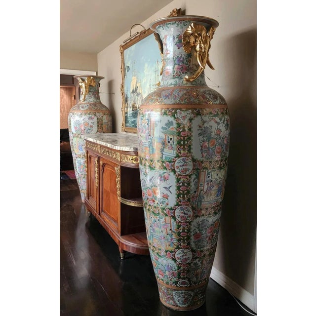 From the estate of Ivana Trump, this extraordinary pair of monumental Chinese Famille Rose porcelain baluster vases, each...