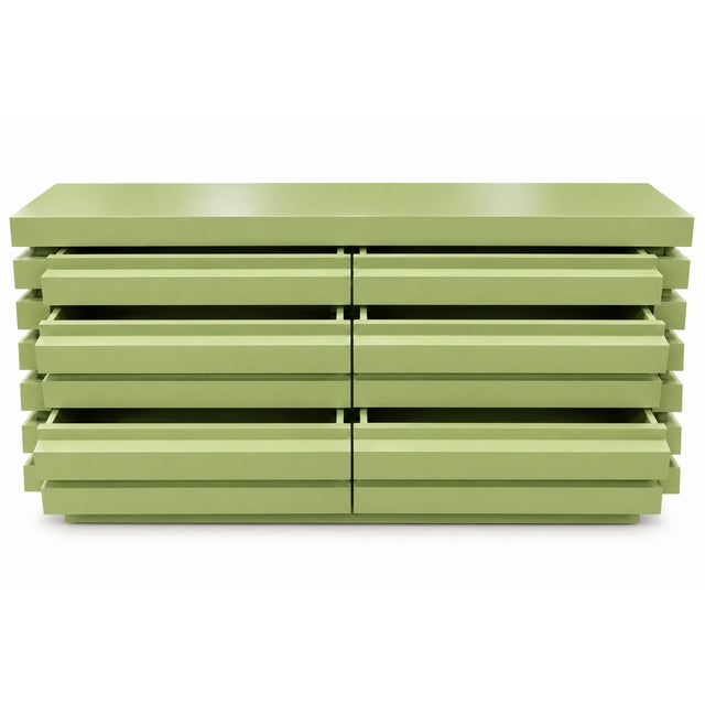 Beautiful mid century style dresser. Dresser is done in a custom finish. The color is a muted chartreuse. Solid alder ....