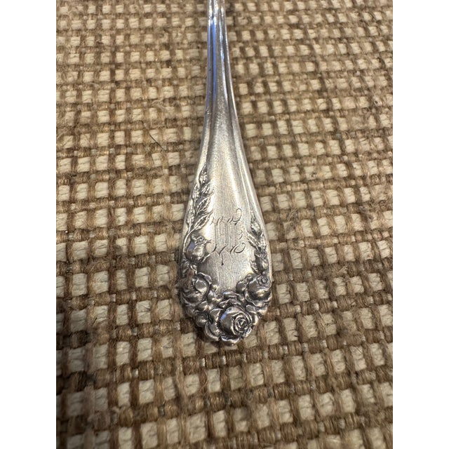 Antique Wallace “Rose Point” sterling silver sauce ladle. Circa 1888. “M” monogram on front handle.
