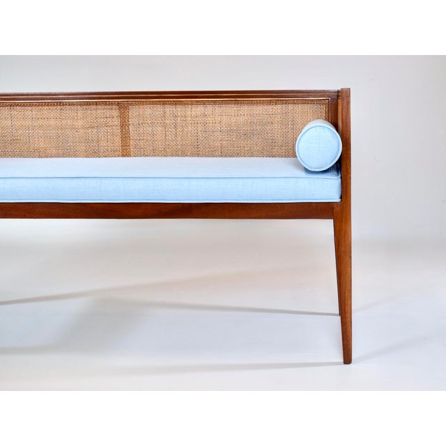 A solid walnut Mid-Century Modern window bench or settee attributed to Edward Wormley for Dunbar. Lithe line design...