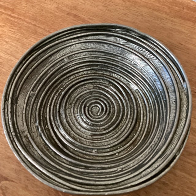 A stunning vintage bowl, handcrafted and signed by artist. The elegant swirl design inside makes a great statement peace.