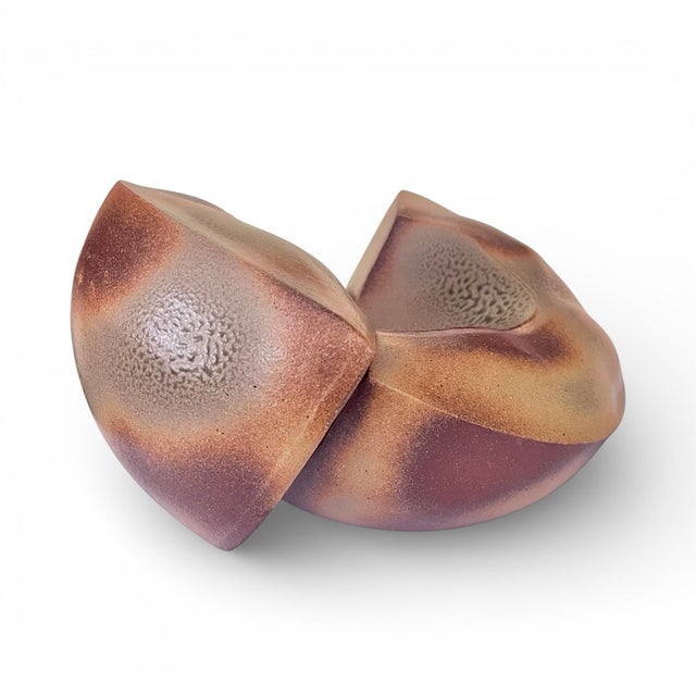 A well executed piece of wood-fired studio pottery in the form of an interlocked two piece deconstructed bowl. Lovely...