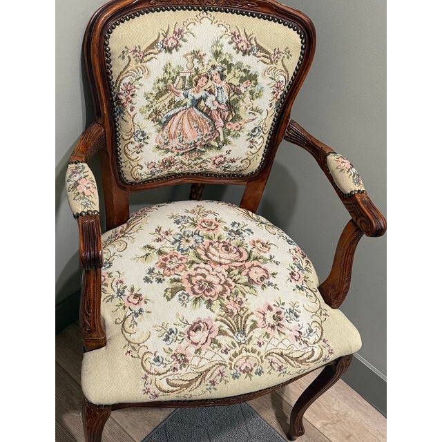 This chair is a Louis XV-style tapestry armchair, a high-quality 20th-century vintage reproduction of a classic 18th-...