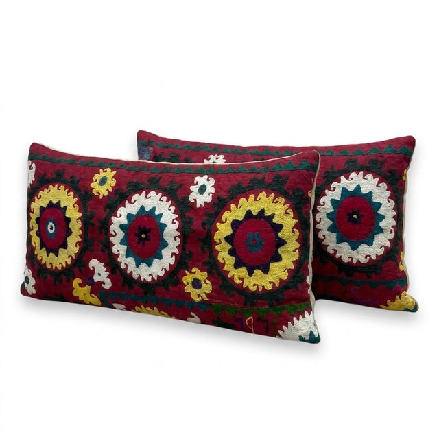 This beautiful 15'' x 33'' & 16'' x 33'' hand-embroidered Suzani pillow cover set was made from authentic Uzbek cotton...